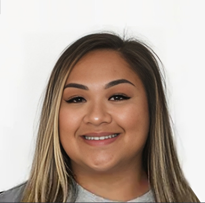 Young woman smiling at camera against white background, professional headshot style photo.