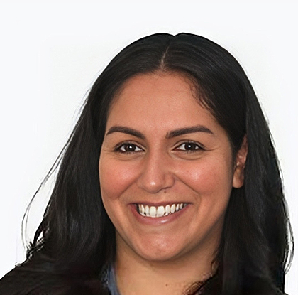 Professional headshot of a smiling woman with long dark hair against a white background.