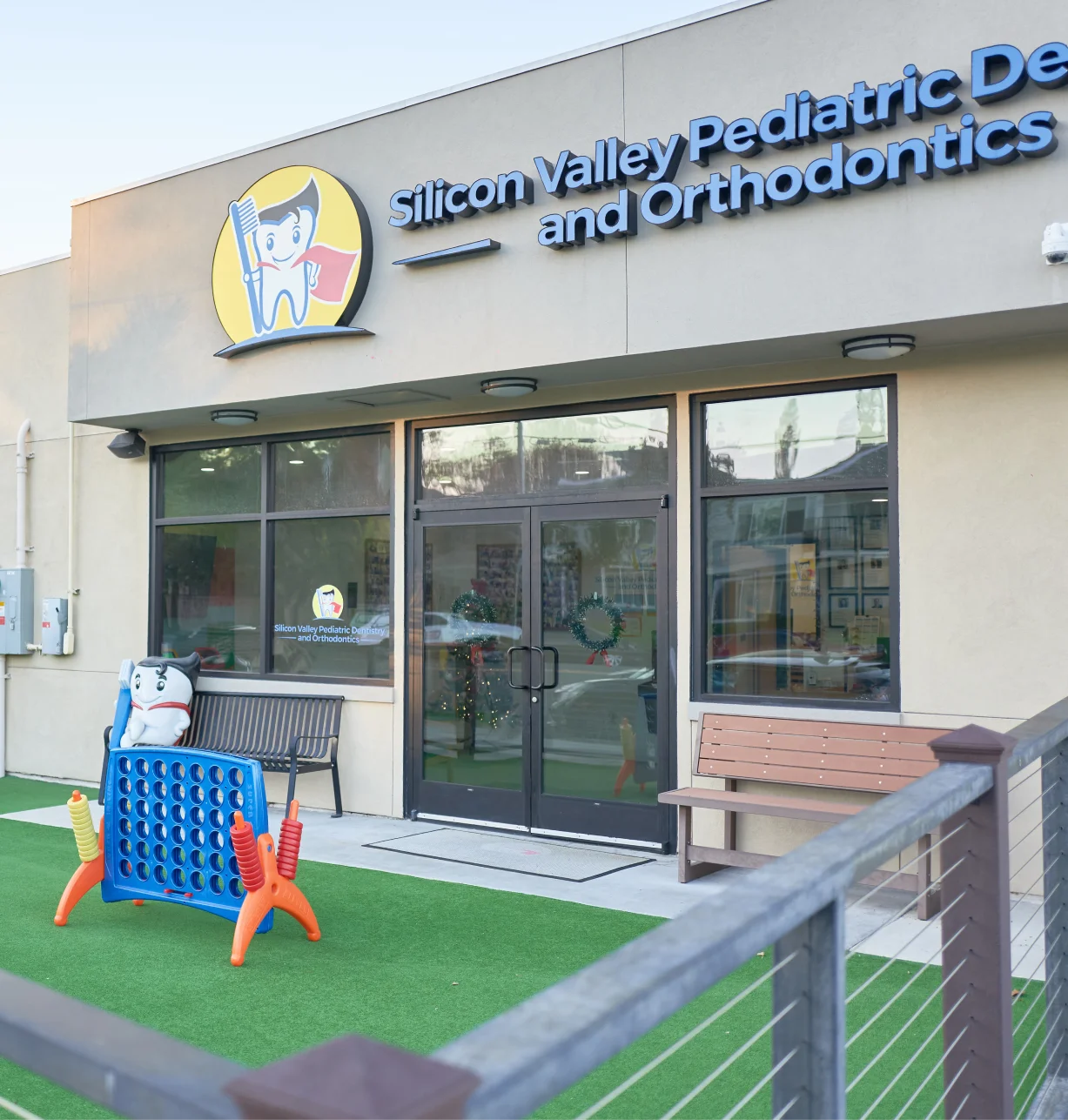 Silicon Valley Pediatric Dentistry & Orthodontics storefront with welcoming entrance and children's play area.